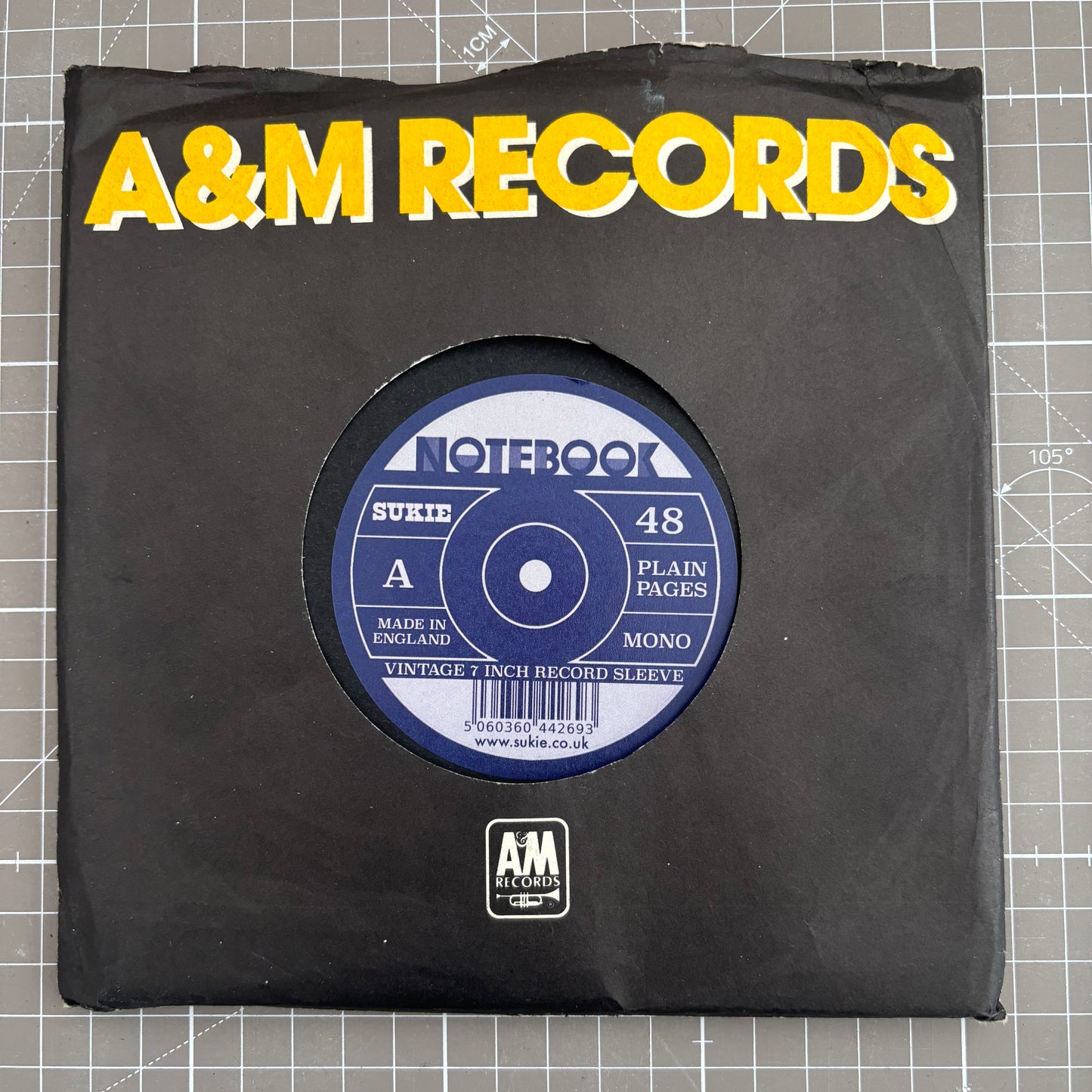 Record Sleeve Notebook with an original 7" vintage record sleeve.